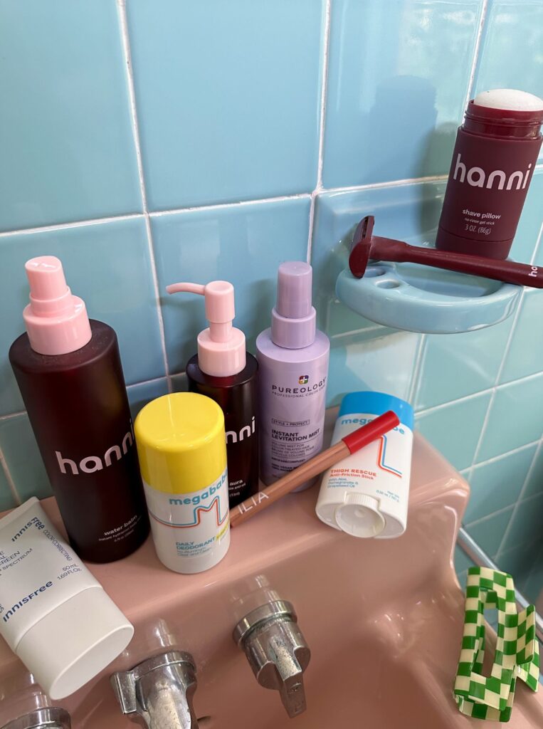 beauty products on washing basin